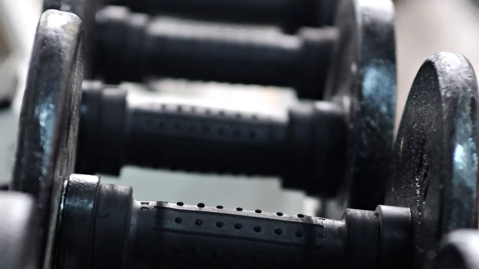 A full rack of fixed dumbbells in a gym, the amount of equipment an adjustable dumbbell set replaces